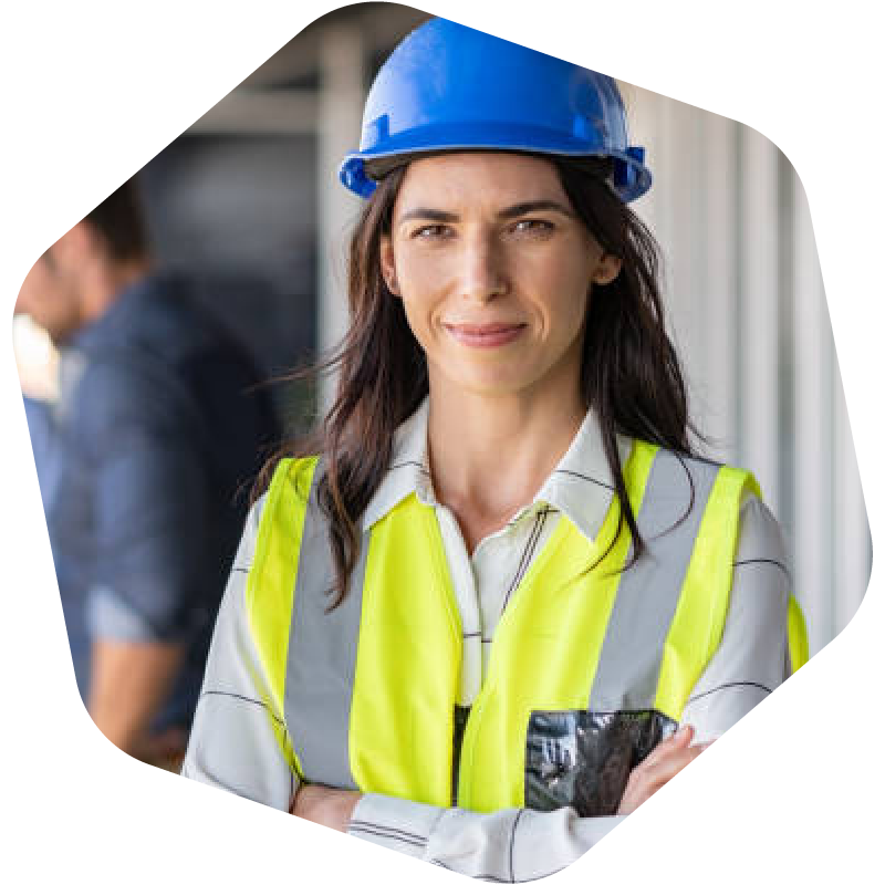 woman wearing hard hat and overalls