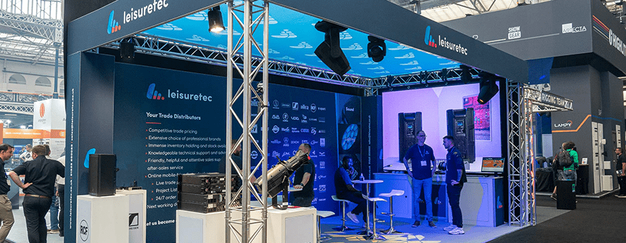 Leisuretec stand at a trade show, with AV equipment on show.