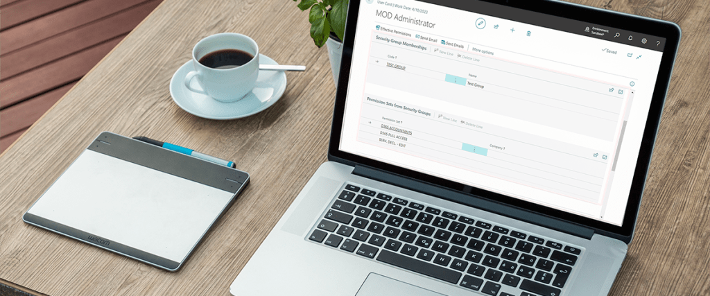 A laptop on a table with Microsoft Dynamics 365 Business Central on the screen.