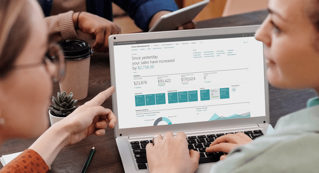 Two women looking at Microsoft Dynamics 365 Business Central on a screen